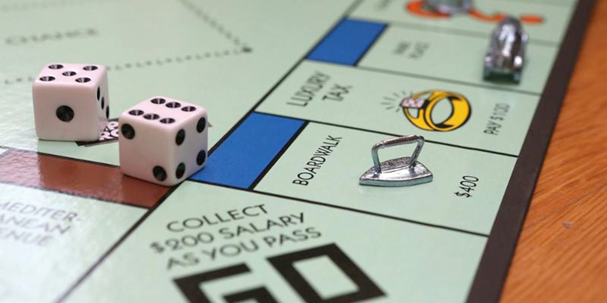 A monopoly board with the game pieces and dice.